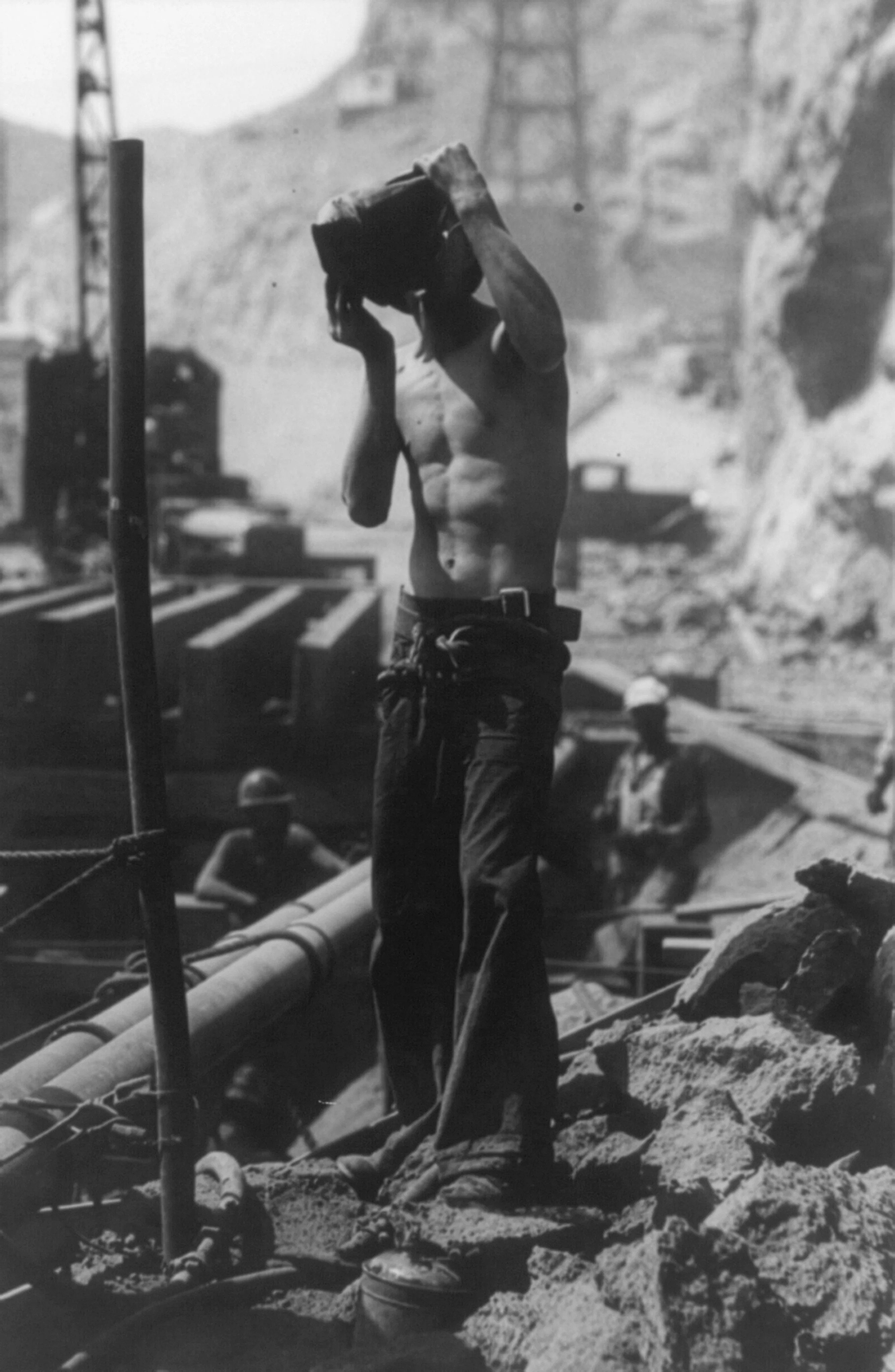 Workman with water-bag during construction
