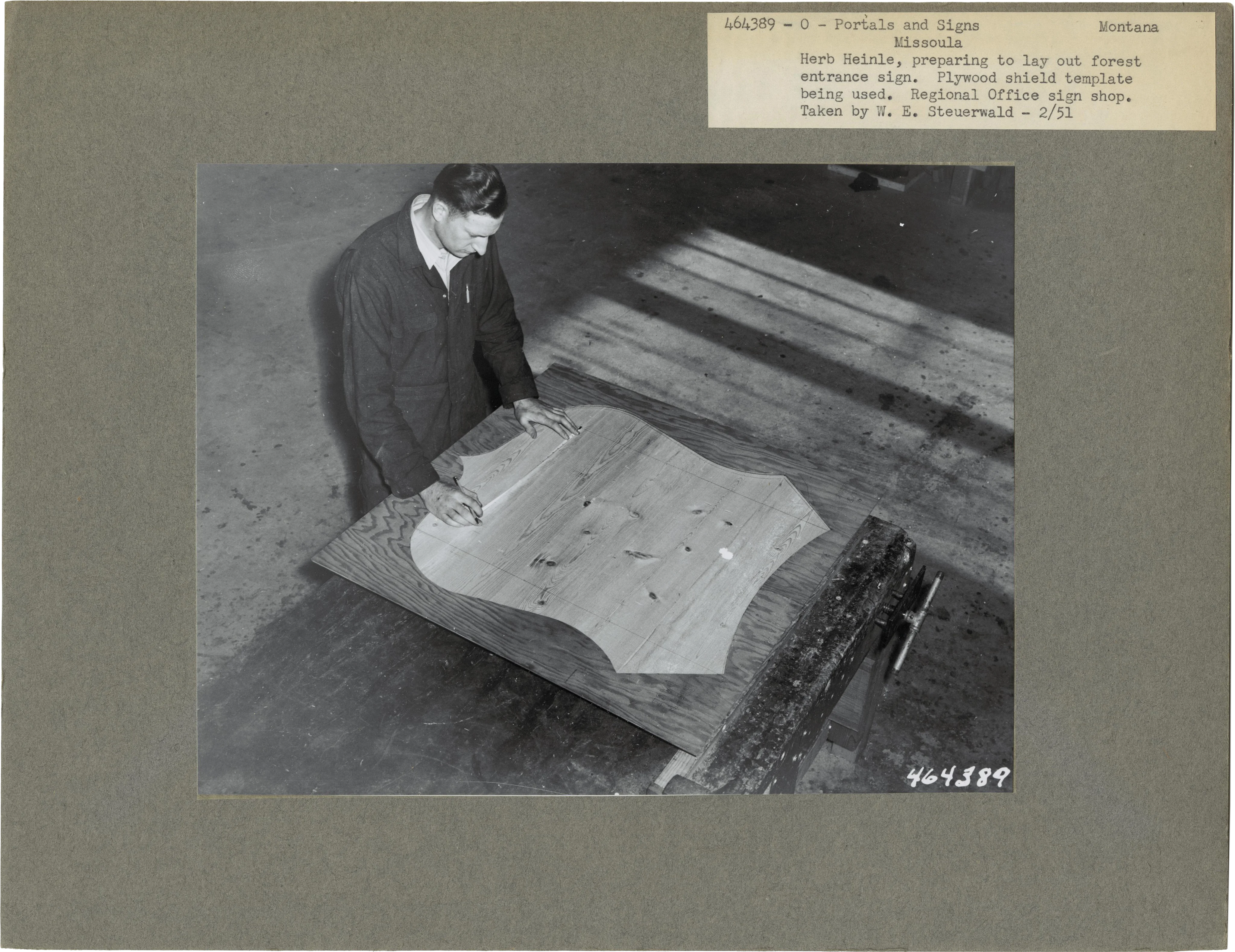 Herb Heinle, preparing to lay out forest entrance sign, 1951